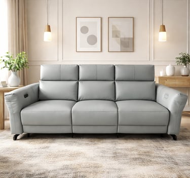 Modern light grey leather power reclining sofa in a minimalist living room with elegant wall decor.