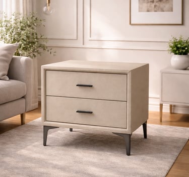 Modern cream faux-shagreen nightstand with two drawers and black metal legs on a neutral area rug.
