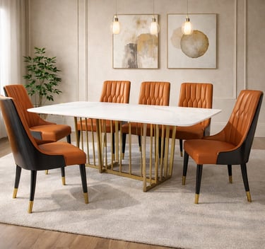 Modern white marble dining table with gold metal legs and orange leather tufted chairs.