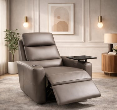 Modern grey leather power recliner chair with a swivel tray table and cup holder in a luxury living room.