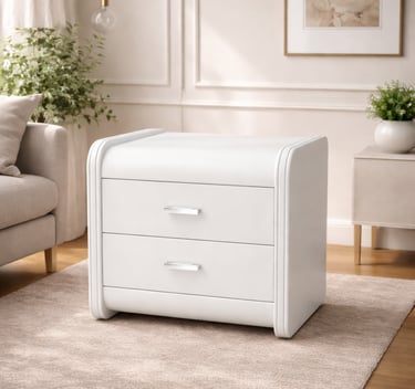 Modern white nightstand with two drawers and silver handles on a neutral area rug in a bright living room.