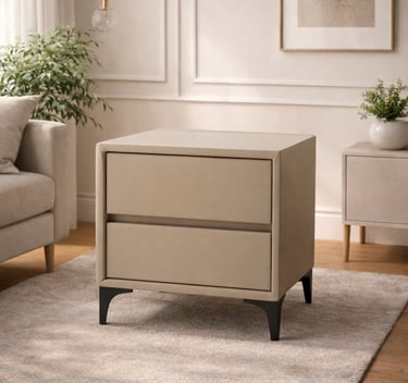 Modern beige upholstered nightstand with two drawers and black metal legs on a plush rug.