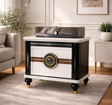 Elegant black and white luxury nightstand with gold accents and ornate circular hardware in a modern living room.