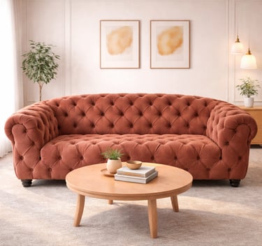 Tufted terracotta velvet sofa in a modern living room with a round wooden coffee table.