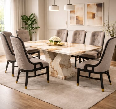 Luxury marble dining table with tufted grey chairs in a modern, elegant dining room.