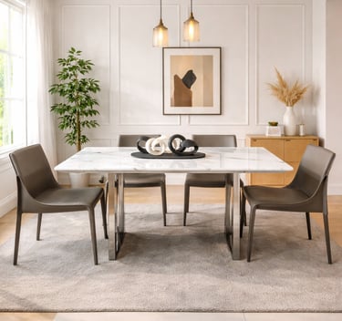 Modern white marble dining table with leather chairs and pendant lights in a minimalist room.