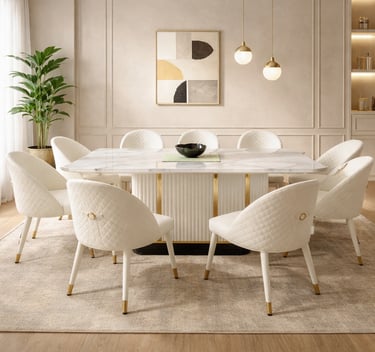 Modern dining room featuring a white marble dining table and quilted chairs with gold legs.