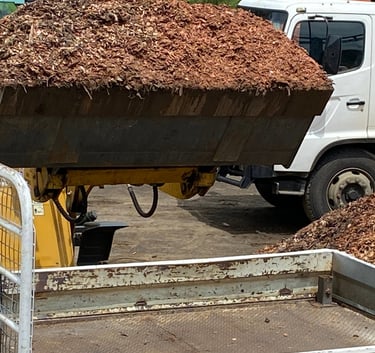 loader with bucket of mulch