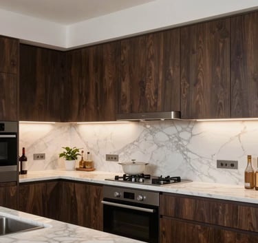 A contemporary renovated kitchen in France featuring deep brown cabinetry, marble countertops, and warm integrated lighting, high-quality finishes.