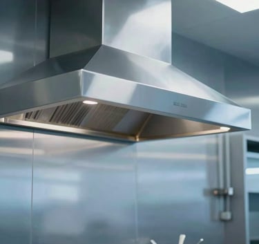 A pristine, high-end commercial kitchen hood in a Toronto restaurant, polished surfaces reflecting soft ambient light, clean modern aesthetic using #F5F7F8 and #3A607C tones.