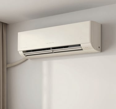 A sleek split air conditioning unit mounted on a minimalist white wall in a modern Latin American living room. Soft daylight, clean lines, professional photography using off-white and light blue tones.