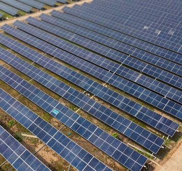 A high-altitude drone shot of a commercial solar farm in Abuja, showcasing rows of high-efficiency panels. The geometric precision and clean lines convey technological advancement. The branding elements like #2A735E are subtly reflected in the landscape and equipment.
