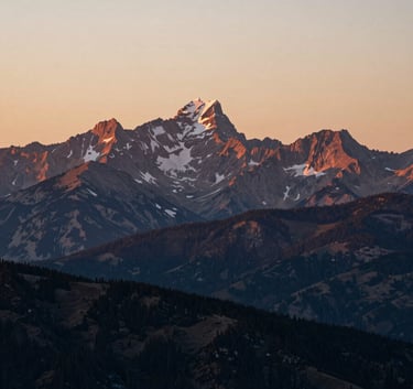 A breathtaking landscape of the pristine Wyoming mountains at sunset. Professional photography, capturing the raw natural heritage of the headquarters. Tones of #F0F5F2 and deep #1C2A2D shadows.