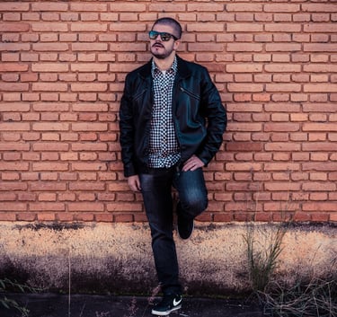 Joe Cruciti wearing sunglasses in a horizontal professional promo photo