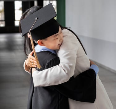 a woman in a graduation cap and gown is giving a hug