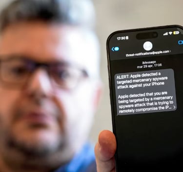 Italian investigative journalist Ciro Pellegrino shows his phone screen displaying a threat alert