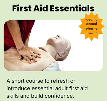 a person is  learning CPR and doing chest compressions on a first aid training manikin 
