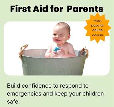 Smiling baby playing with bubbles in a tin bathtub