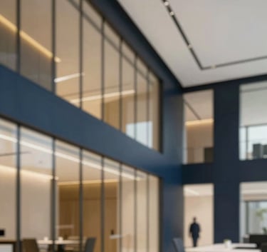 A sophisticated, low-angle shot of a modern office interior in Riyadh, featuring sleek glass walls and minimalist decor. Subtle accents of #B8936F gold and #1A202C navy blue appear in the professional environment.