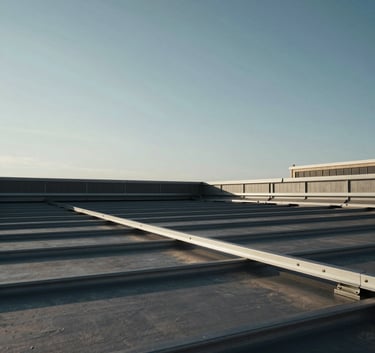 Low angle shot of a large industrial roofing project in North American / NYC, steel gray sky, high-contrast lighting, sharp architectural lines against a clear morning sky.