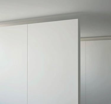 Photography of a finished, minimalist white ceiling and partition wall in a modern office space in South Holland. Soft, natural lighting, professional and clean aesthetic.