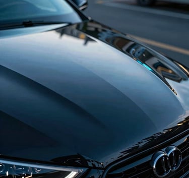 Cinematic macro photography of a glossy black car hood reflecting electric blue neon lights, high-end automotive aesthetics, International / Global.