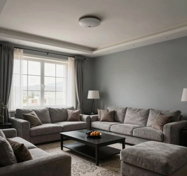 Wide angle photography of a beautifully finished modern Turkish living room in Aksaray. The walls are painted in a perfect clouds grey finish. Soft natural light coming from the window.