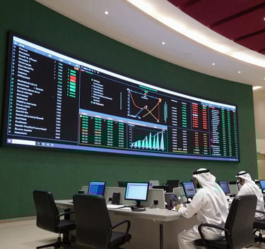 A wide-angle shot of a high-tech Omani control center with large LED displays showing data analytics. The lighting is modern with accents of matte forest green and deep crimson. Professional atmosphere in a Middle Eastern / Gulf corporate setting.