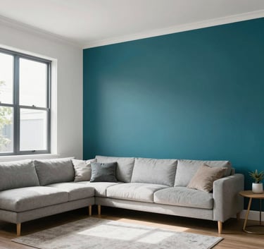 A bright and airy Auckland living room featuring a flawless deep teal feature wall and fresh white ceilings, minimalist decor, natural light through large windows.