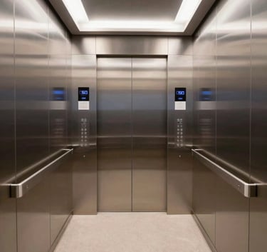 A wide-angle interior shot of a modern, brightly lit elevator car with mirror finishes and a digital floor display, reflecting a clean and professional atmosphere.