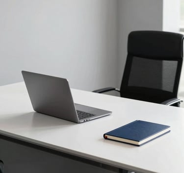 A minimalist, high-end executive desk in a Latin American corporate office. Clean lines, a single laptop, and a notebook in midnight blue and snow white.
