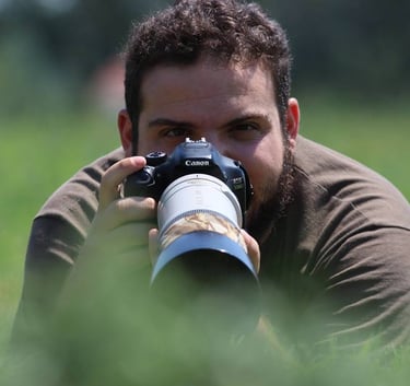 a man taking photo with telephoto lens