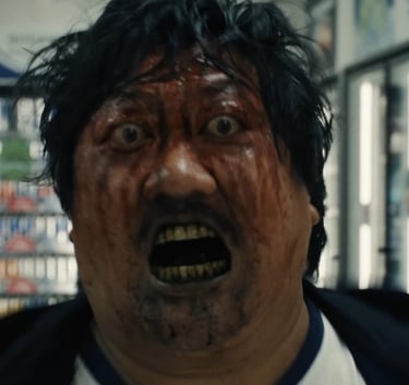 A blood-covered man screams in terror inside a brightly lit supermarket aisle, with shelves stocked