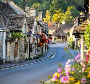 a street scene with a road and houses