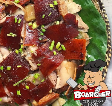lechon on a banana leaf plate