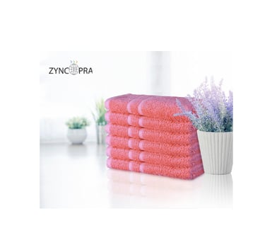 Luxury hotel towels in pink.