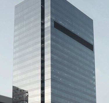 Sophisticated modern skyscraper with a seamless glass glazing facade reflecting a clear sky. Inset panels of dark ACM for architectural contrast. Clean lines, ultra-modern vibe, professional architectural photography style using #1A202C and #EDF2F7 palette.