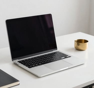 A clean, minimalist North American / US workspace with a sleek laptop on a Soft Pearl desk, a single Muted Gold decorative object, sharp focus, bright and airy lighting, sophisticated corporate atmosphere.