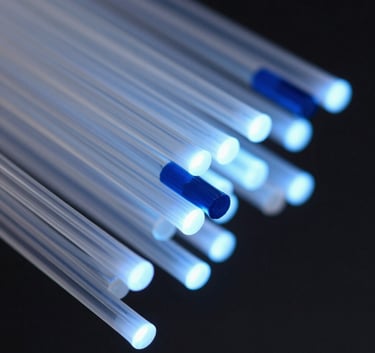 A sophisticated abstract close-up of optical fibers glowing with soft blue and deep navy blue light, representing high-speed data flow. Clean, sharp focus with a minimalist Scandinavian aesthetic.