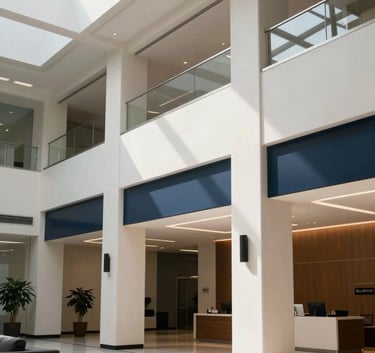 A sleek, professional North American corporate lobby with high ceilings, soft daylight, and modern architecture in off-white and dark navy tones.