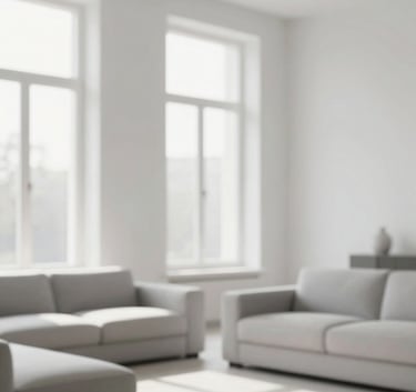 Interior shot of a minimalist, light-filled living room featuring soft gray upholstery (#CED4DA) and white walls (#F5F7F8). The composition focuses on natural light pouring through large windows, emphasizing a sense of space and tranquility.