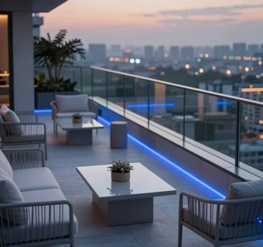 A high-angle architectural photograph of a luxury penthouse terrace at dusk. The scene features minimalist outdoor furniture in #CED4DA tones, with subtle blue ambient lighting reflecting off glass railings. Professional, elegant, and modern aesthetic.