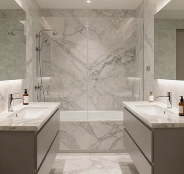 A wide shot of a stunningly renovated modern bathroom in a Southern European / Italian home, featuring clean marble surfaces, minimalist fixtures, and soft natural lighting that emphasizes technical precision and elegant design.