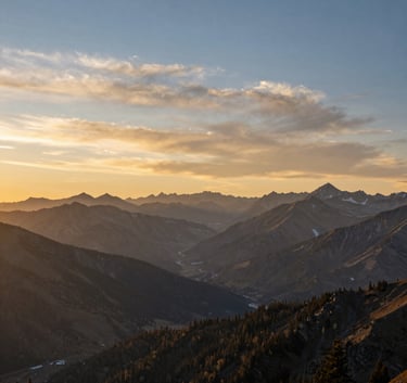 A breathtaking North American mountain landscape at sunrise, with a warm gold and steel blue sky reflecting a sense of hope and new beginnings.