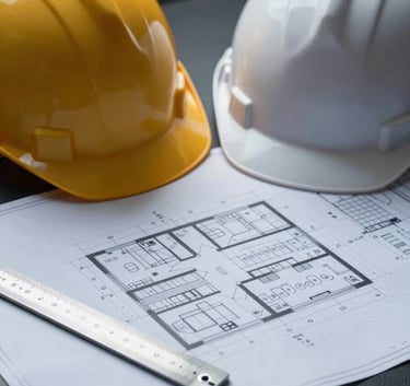 A high-end, clean still life of a construction project plan spread across a dark desk. A professional hard hat and a high-precision metal ruler sit on the blueprints. The lighting is focused and dramatic, using the palette #1A202C and #F7FAFC to emphasize a workspace of expert craftsmanship.