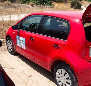 Anastasia's Rental Car in Milos Greece- red small car