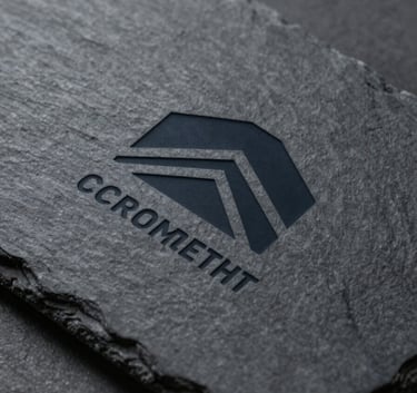 A professional minimalist logo of a construction company etched on a dark textured slate background (#2D323A), representing solidity and modern elegance.