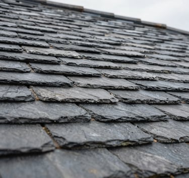 Close-up photography of perfectly aligned natural slate roof tiles on a French house, showcasing precise craftsmanship and water-tight installation, sharp focus, overcast soft lighting.