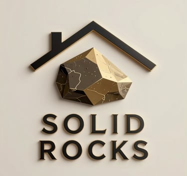 A minimalist and luxury logo for 'SOLID ROCKS' real estate. It features a stylized, geometric rock formation combined with an abstract roof shape, using gold and black colors. The typography is elegant, bold, and modern.