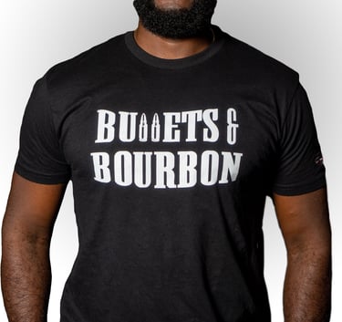 a man wearing a black shirt with the words Bullets & Bourbon